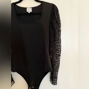 Black body suit with fun sleeves